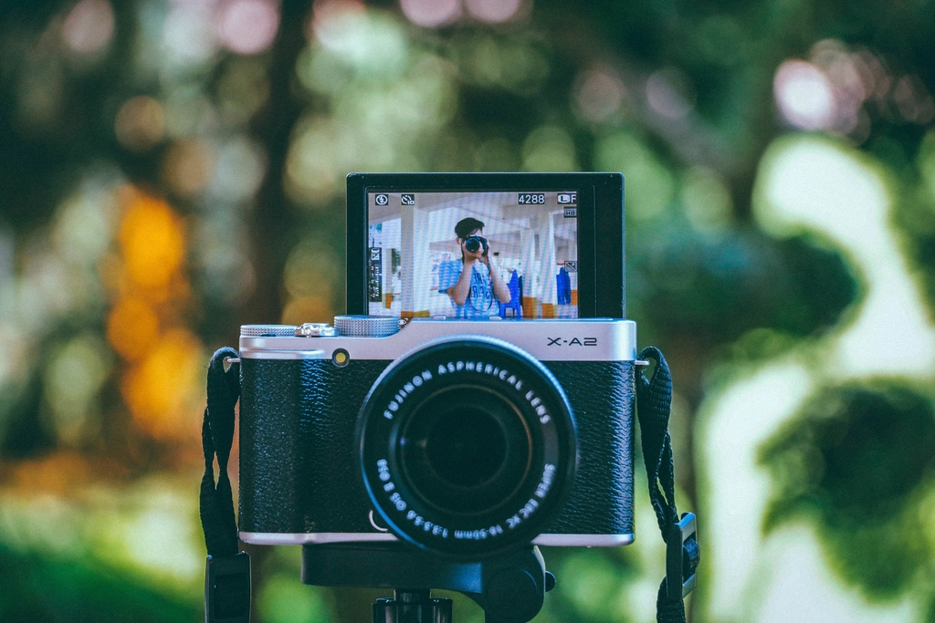 Creator filming himself on camera, producing branded content that carries separate usage rights value
